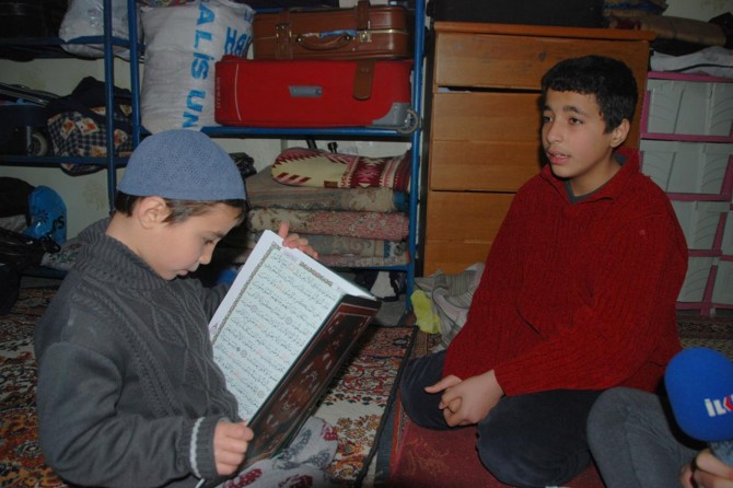 Syrian children do not interrupt their hafiz studies