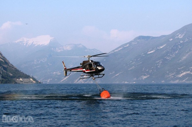 Firefighting helicopter crashes to dam