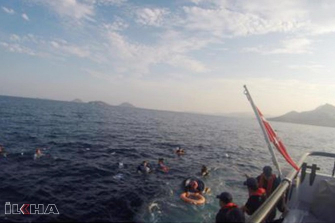 At least 12 drown, 31 rescued after migrant boat sinks off Aegean coast