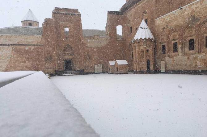 With snow falling, Ishak Pasha Palace dressed in white
