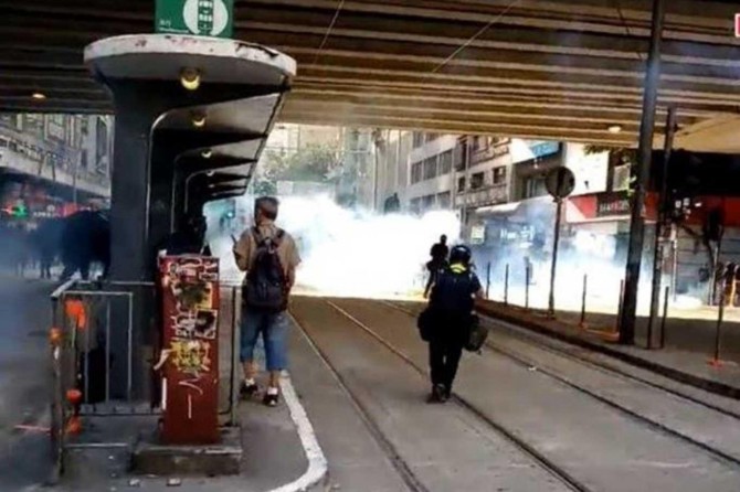 Police fires tear gas to break up thousands of anti-government protesters in Hong Kong