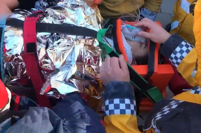 A woman rescued from the rubble 17 hours after quake in Elazığ
