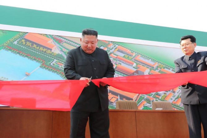 Kim Jong Un makes his first public appearance in 20 days amid rumors of his death