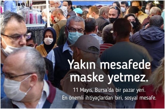 Bakan Koca, pazar yerindeki bir fotoğrafı paylaşarak maske ve sosyal mesafe uyarısı yaptı