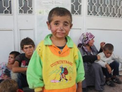 Suriyeli çocukların yüzünde savaş izleri