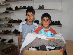 Van Rahmet Eli'nden giyim yardımı